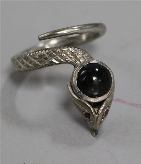 A white metal and star sapphire set serpent ring, size O.